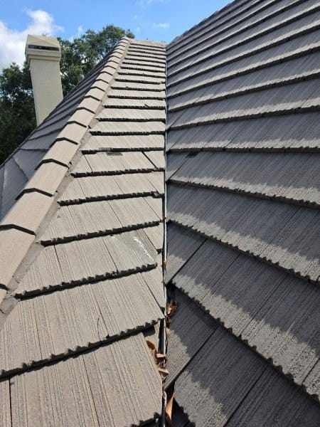 Close-up of a concrete tile roof ridge line on a Central Florida home